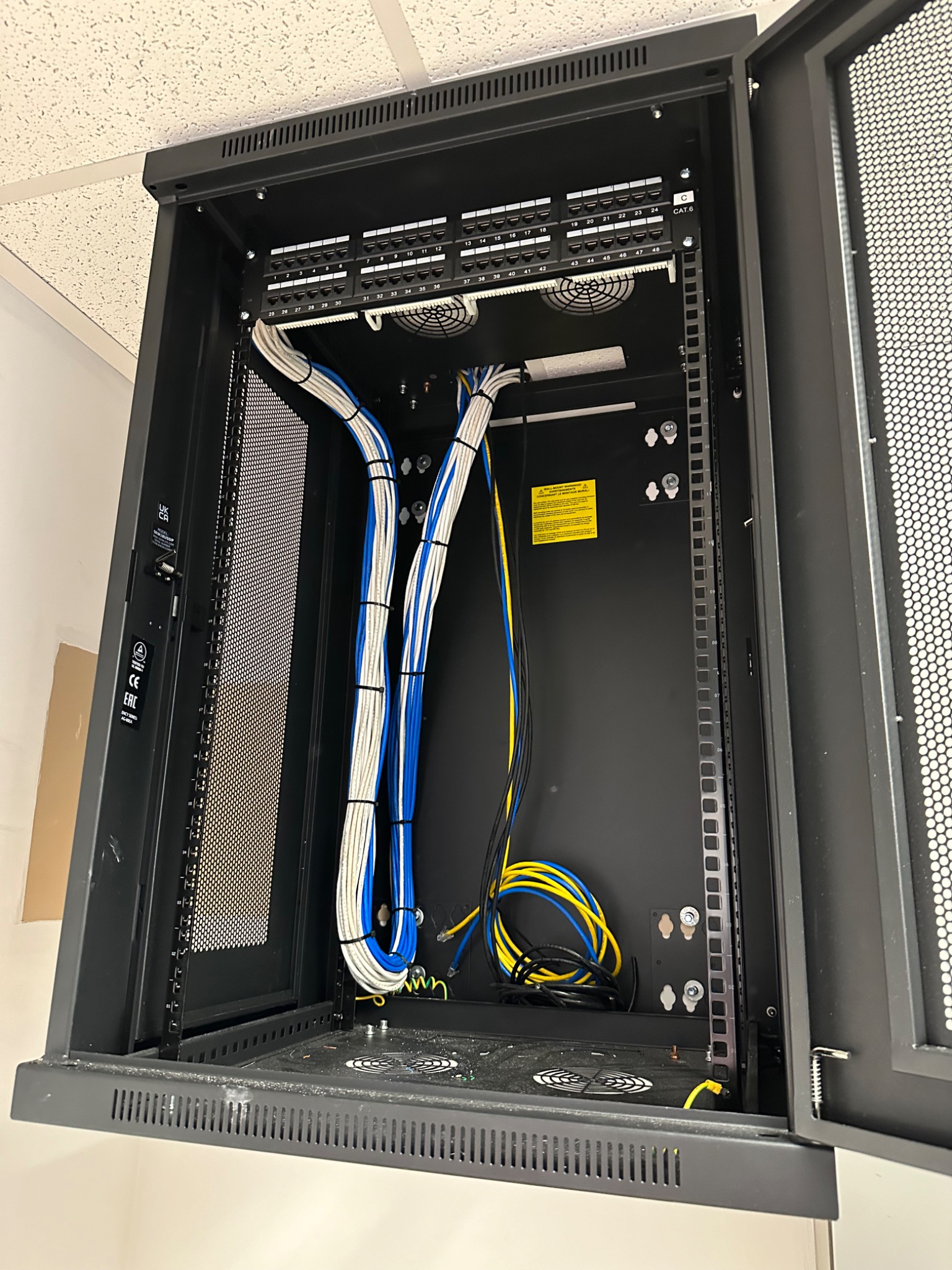 Organized cabling inside a network cabinet