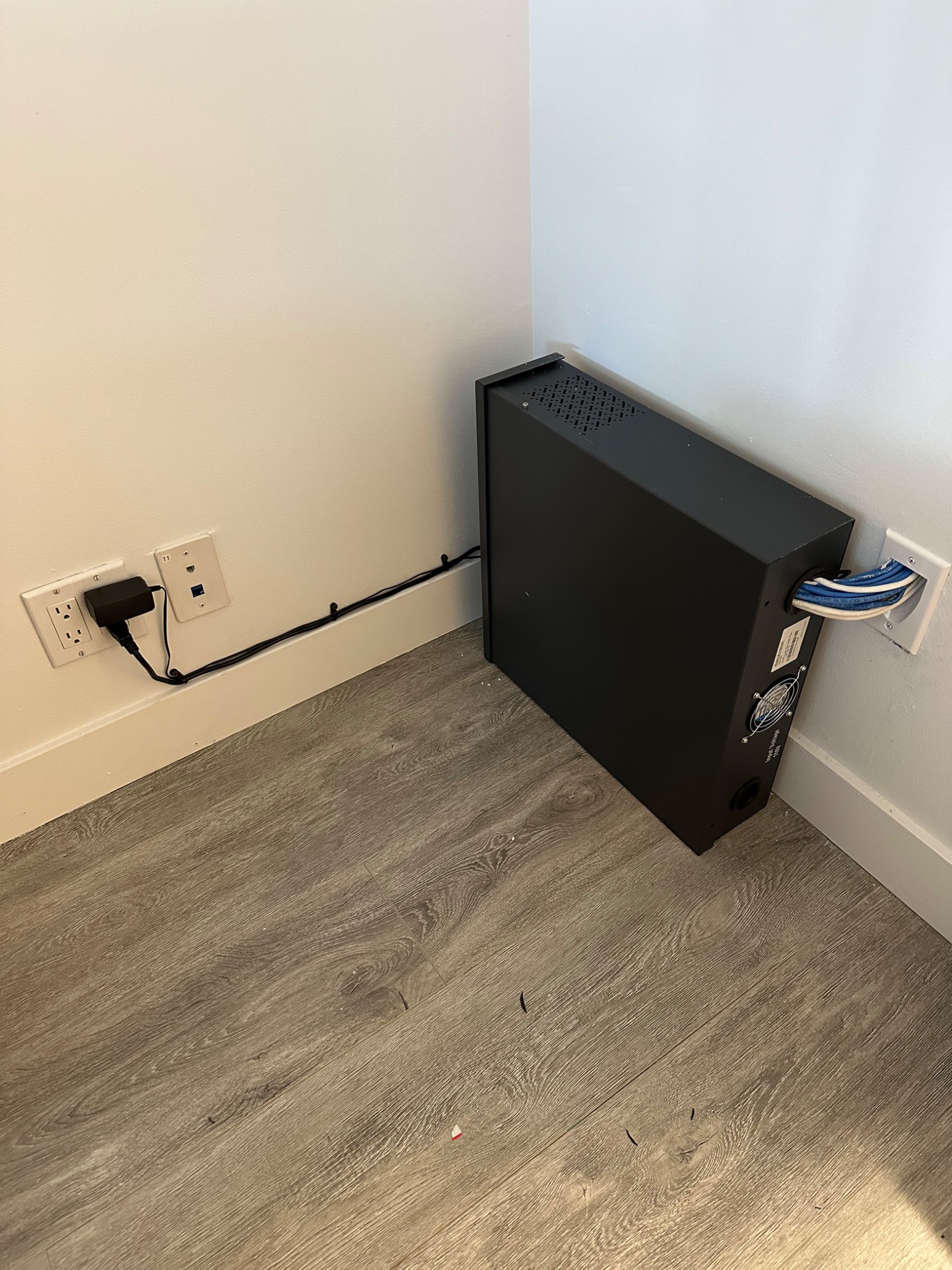 Wall-mounted network cabinet installation